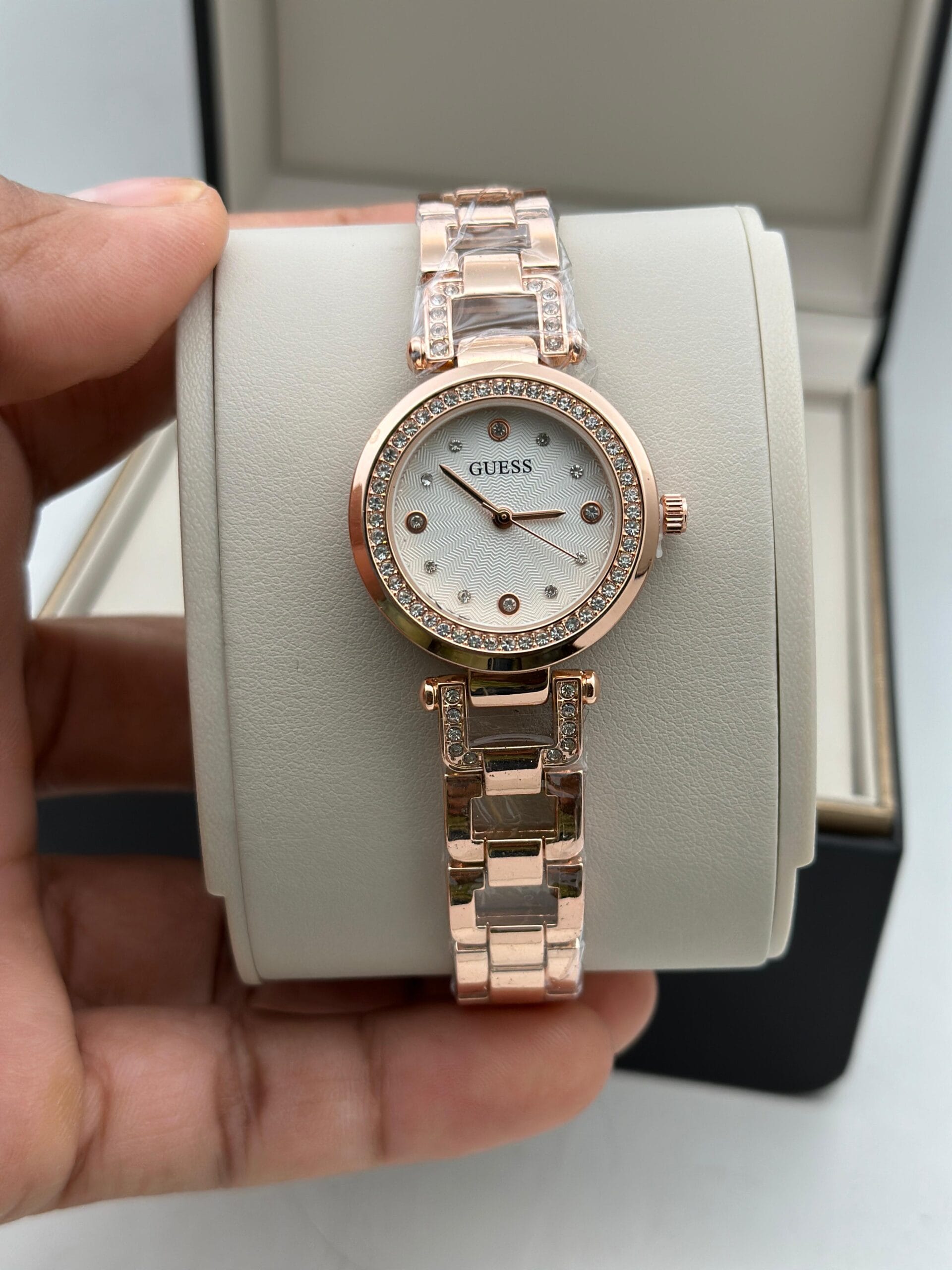 Guess Women’s Crystal Edition Watch | Black Dial with Gold-Tone Chain | Elegant & Timeless Design 2 Guess Womens Crystal edition rose gold white dial hand view