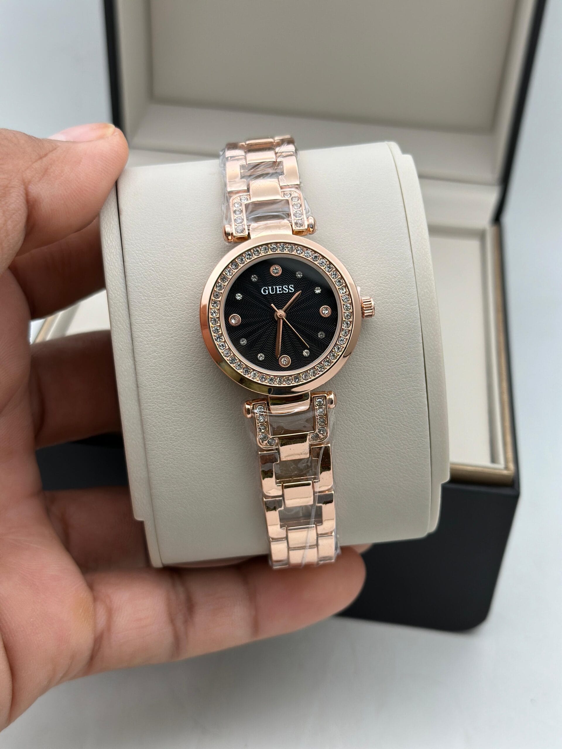 Guess Women’s Crystal Edition Watch | Black Dial with Gold-Tone Chain | Elegant & Timeless Design 6 Guess Womens Crystal edition rosegold hand view