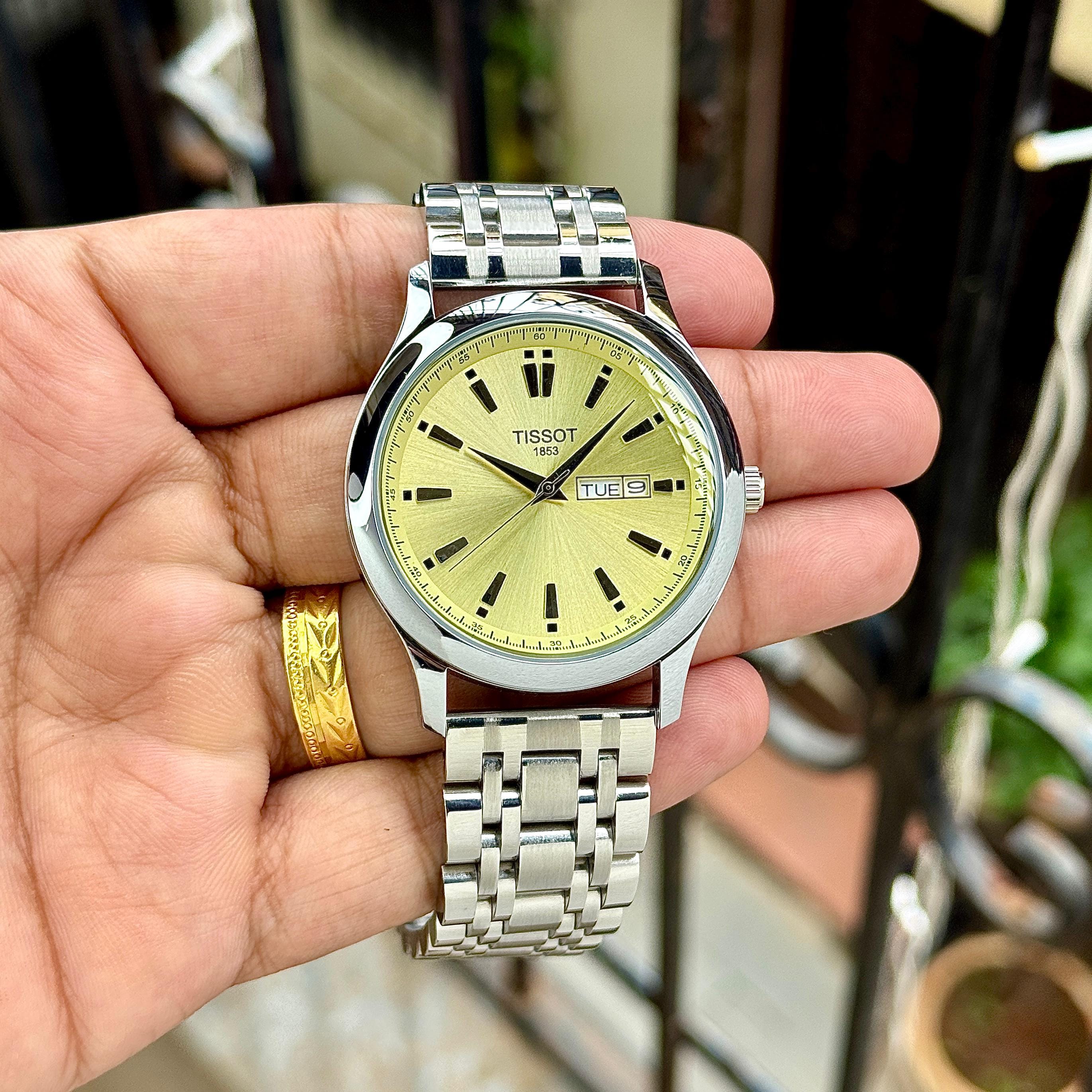 Tissot Quartz Day & Date Classic Men’s Premium Watch Champagne Gold Dial Swiss-Style Elegance Edition 2 Tissot Quartz Day & Date Classic Men’s Premium Watch hand view