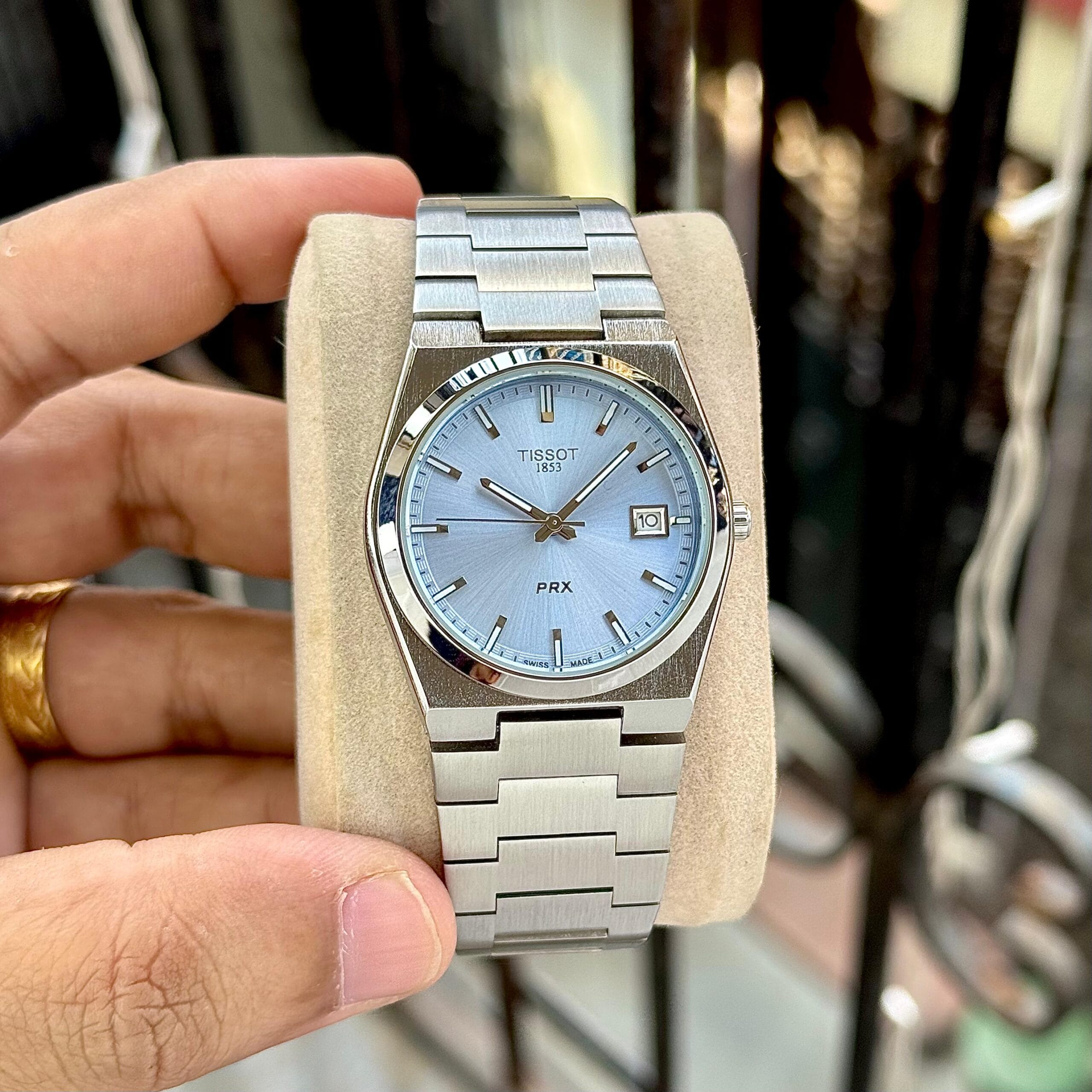 Tissot PRX Men’s Premium Watch Ice Blue Sunburst Dial • Integrated Steel Bracelet PRX Classic Slim Edition (35mm 2 Tissot PRX Men’s Premium Watch ice blue Sunburst hand view