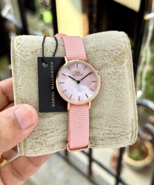 Daniel Wellington coral pink women watch round dial on cushion