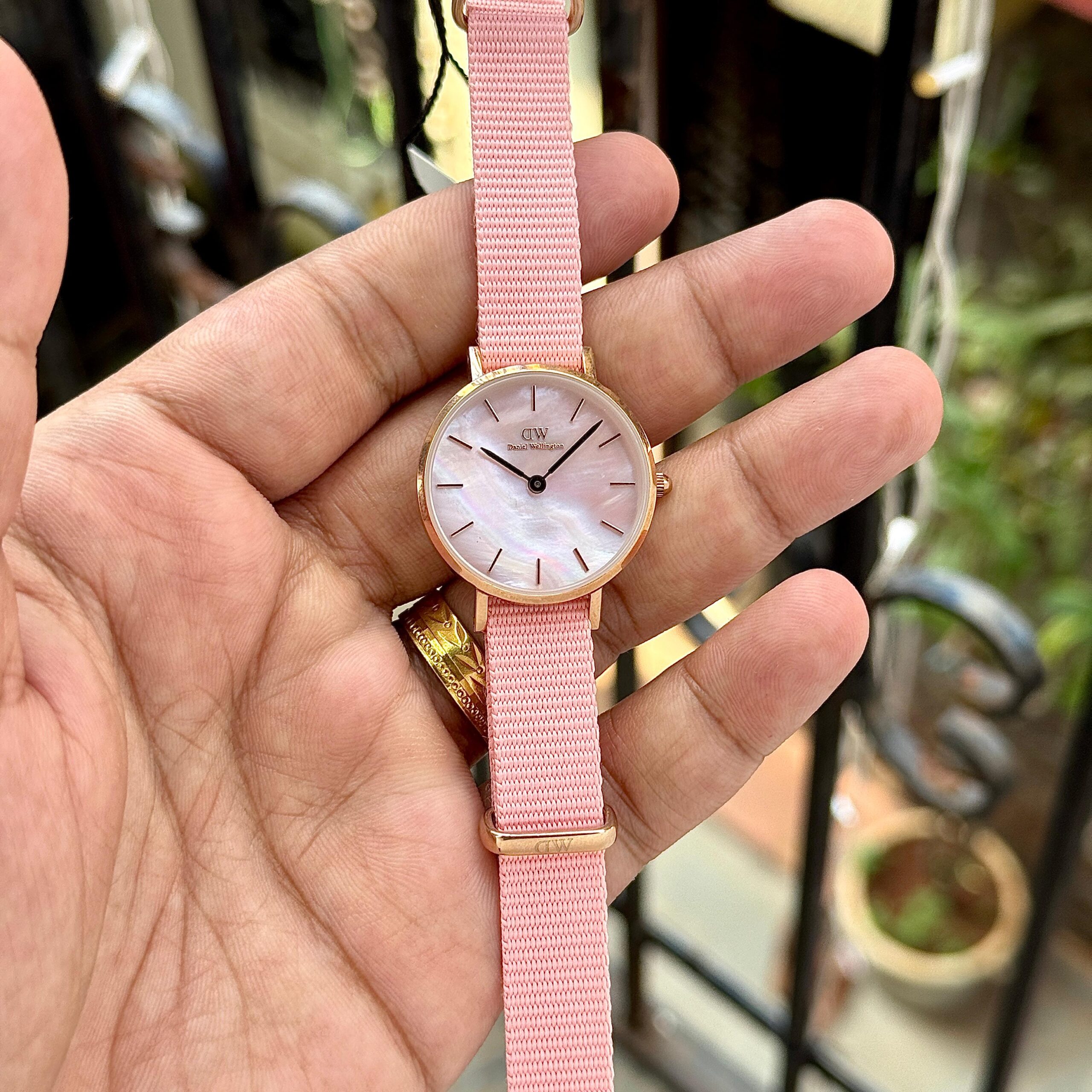 Daniel Wellington Coral Pink Petite & Quadro Women Watch Mother of Pearl Dial 2 Daniel Wellington quadro coral pink women watch in hand