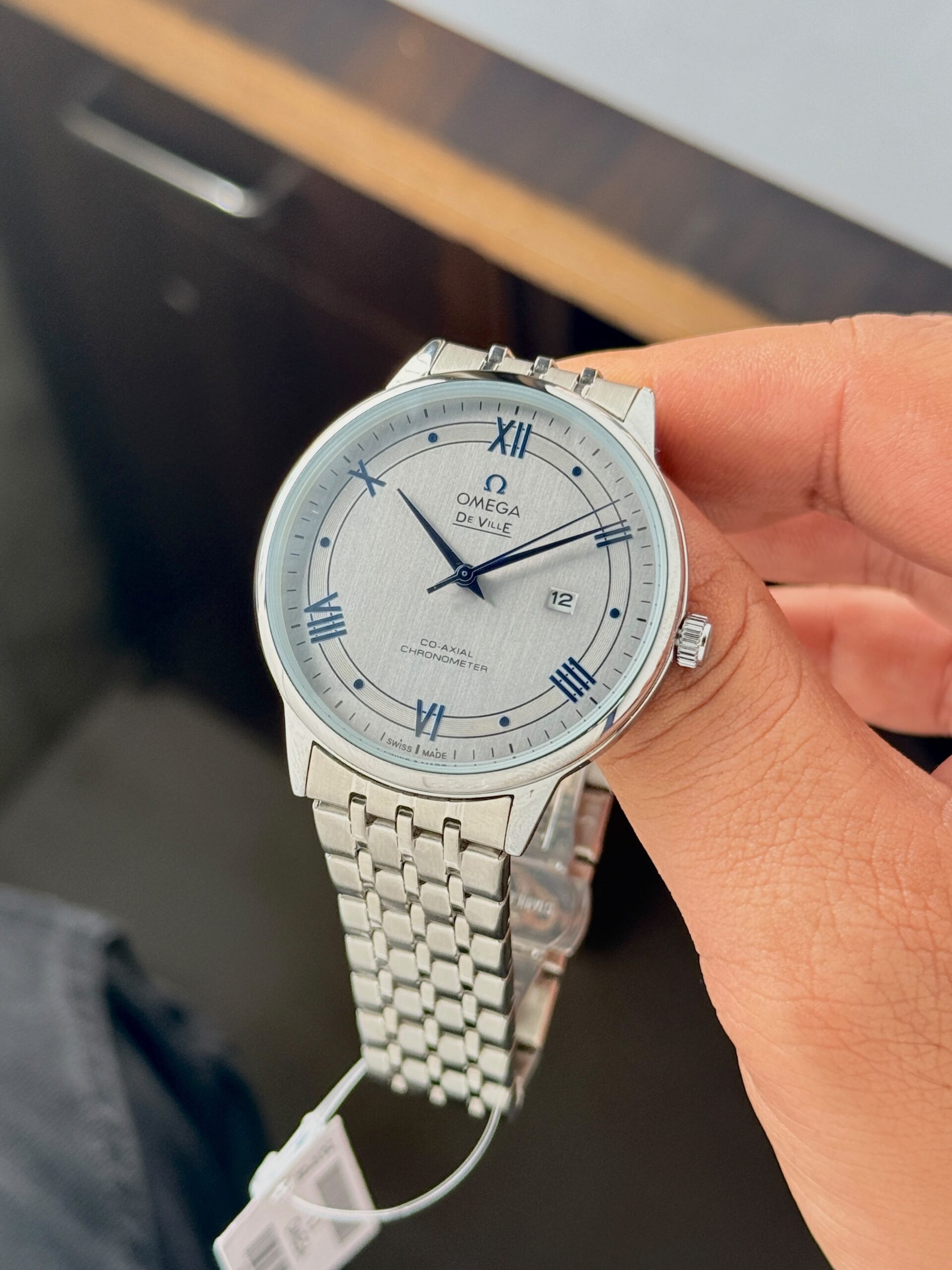 Omega De Ville 7AA Quartz Men's Watch Blue/Silver Dial Silver Stainless Steel Bracelet 4 Omega De Ville Silver Dial Stainless Steel Bracelet Angle View
