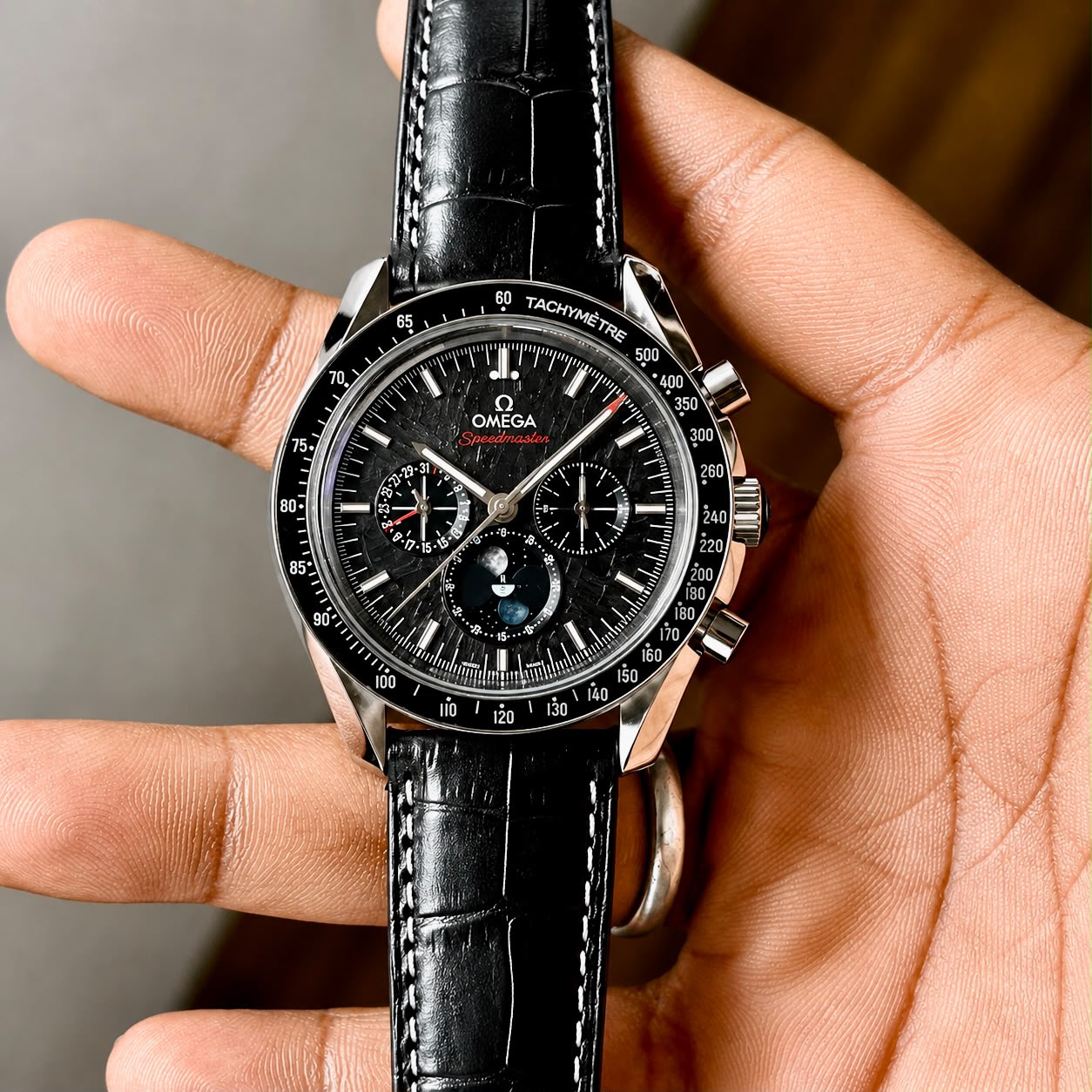Omega Speedmaster Moonphase Automatic Men's Watch Black Meteorite Dial 1 Omega Speedmaster Moonphase Automatic black meteorite dial front view